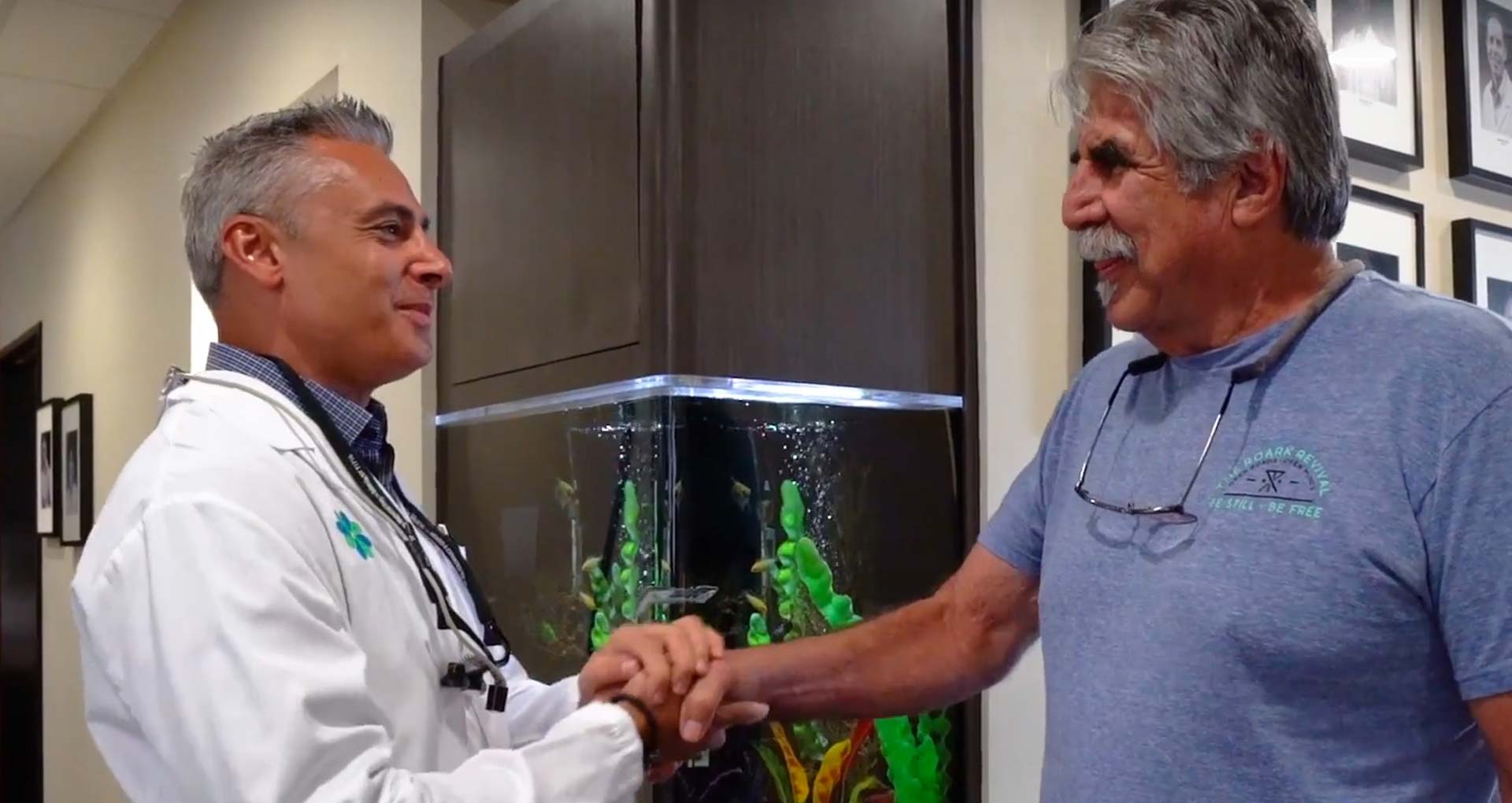 A clinician greeting a patient at Implants 4 Life.